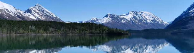 alaskan lake view with mountains in background